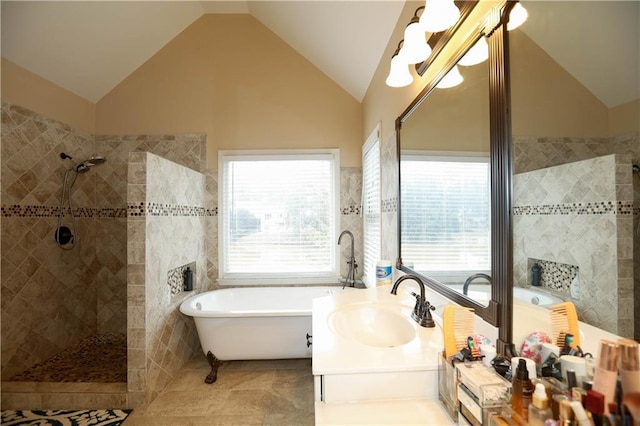 4000 Longlake Dr, Duluth, GA 30097 - bathroom with vaulted ceiling, a walk in shower, a freestanding tub, a chandelier, and vanity