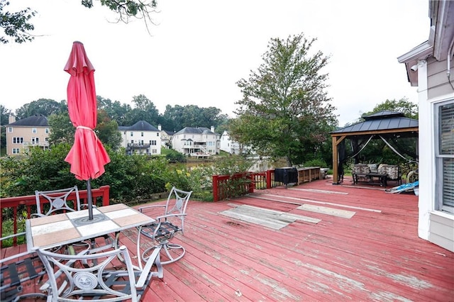 4000 Longlake Dr, Duluth, GA 30097 - wooden terrace with a gazebo, outdoor dining area, and a residential view