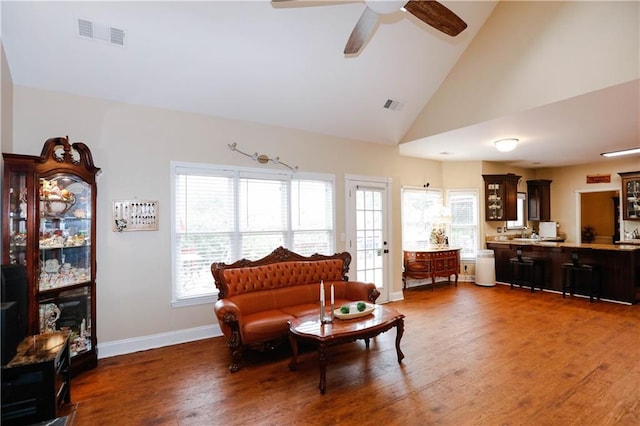 4000 Longlake Dr, Duluth, GA 30097 - living area with wood finished floors, ceiling fan, high vaulted ceiling, and baseboards