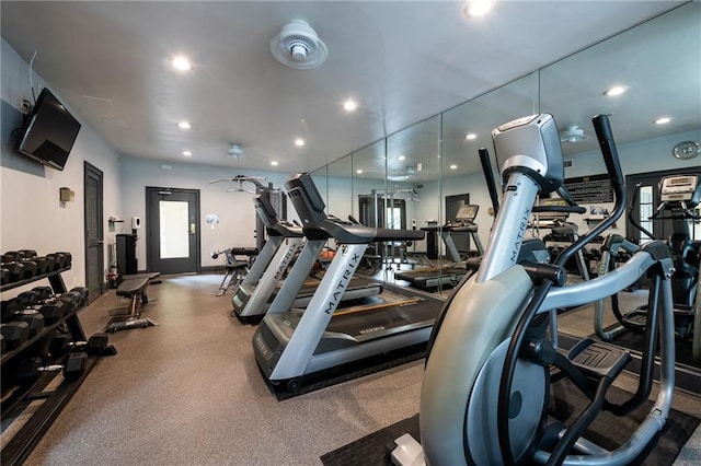 gym with baseboards and recessed lighting