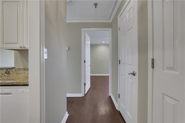 hall with ornamental molding and dark hardwood / wood-style flooring