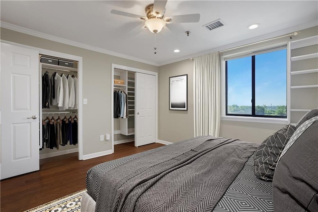 bedroom with ceiling fan, ornamental molding, and hardwood / wood-style flooring