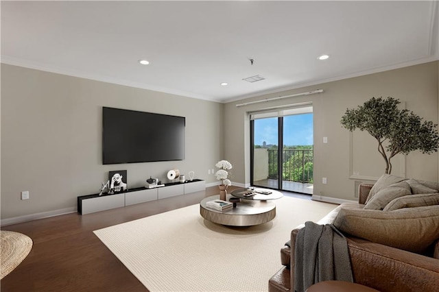 living room featuring hardwood / wood-style floors and crown molding