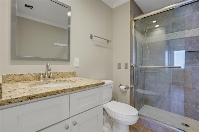 bathroom with toilet, ornamental molding, walk in shower, and vanity