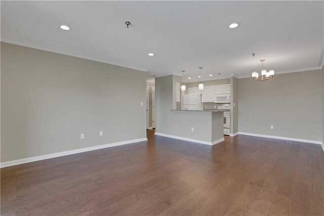 unfurnished living room featuring crown molding, a notable chandelier, and dark hardwood / wood-style flooring