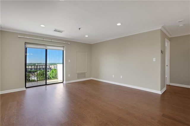 empty room with ornamental molding and dark hardwood / wood-style flooring