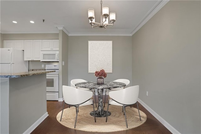 dining room with ornamental molding, a chandelier, and dark hardwood / wood-style flooring