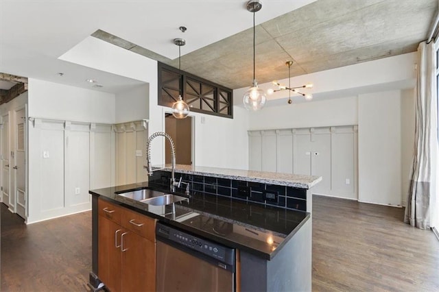 44 Peachtree Pl NW Unit 1728, Atlanta, GA 30309 - kitchen with stainless steel dishwasher, a sink, dark wood-style flooring, an island with sink, and decorative light fixtures