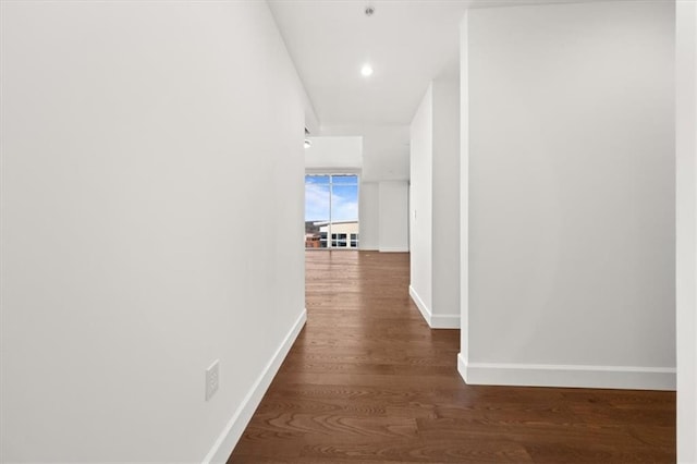 hall with dark hardwood / wood-style floors