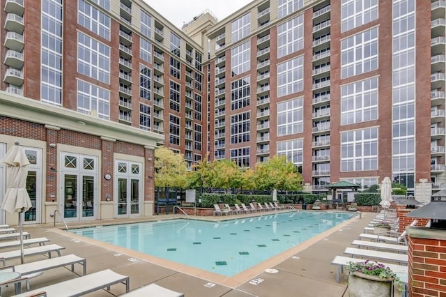 view of swimming pool with a patio