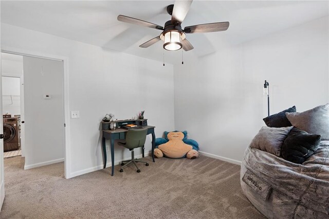 carpeted bedroom with washer / dryer, baseboards, and a ceiling fan