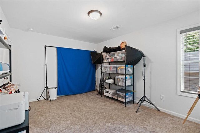 carpeted bedroom featuring baseboards