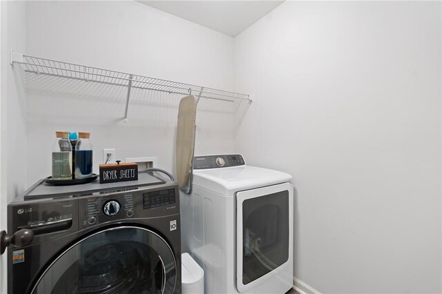 laundry area featuring laundry area and washing machine and clothes dryer