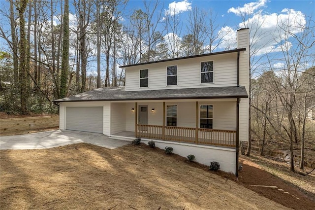 view of front of home with covered porch, concrete driveway, a chimney, and a garage