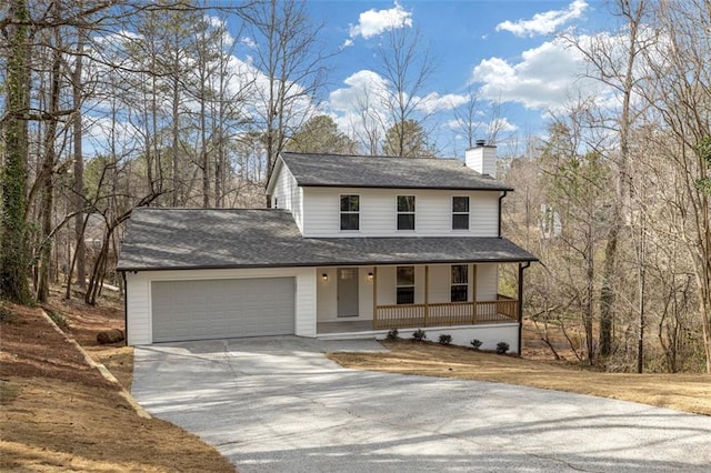 view of front of house featuring a chimney, a porch, a shingled roof, a garage, and driveway