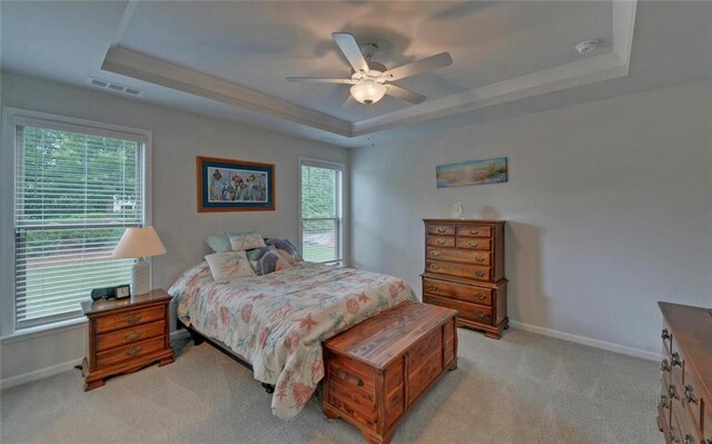 6003 Rollingwood Way, Hoschton, GA 30548 - bedroom with a tray ceiling, light colored carpet, and ceiling fan