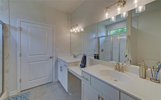 6003 Rollingwood Way, Hoschton, GA 30548 - full bathroom featuring a shower stall, double vanity, and tile patterned flooring