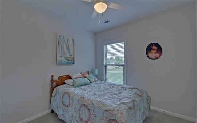 6003 Rollingwood Way, Hoschton, GA 30548 - carpeted bedroom featuring baseboards and a ceiling fan