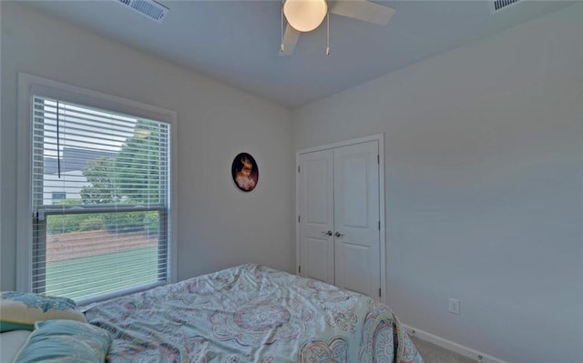6003 Rollingwood Way, Hoschton, GA 30548 - bedroom with carpet flooring, ceiling fan, and a closet