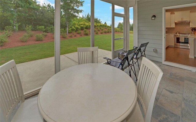 6003 Rollingwood Way, Hoschton, GA 30548 - sunroom with outdoor dining space and area for grilling