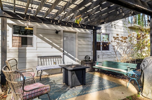 view of patio with a fire pit and a pergola