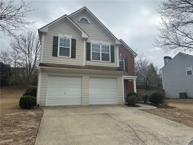 view of front facade with central AC, concrete driveway, and an attached garage