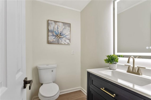 5759 Albans Way, Lithonia, GA 30058 - half bathroom with toilet, wood finished floors, vanity, ornamental molding, and baseboards