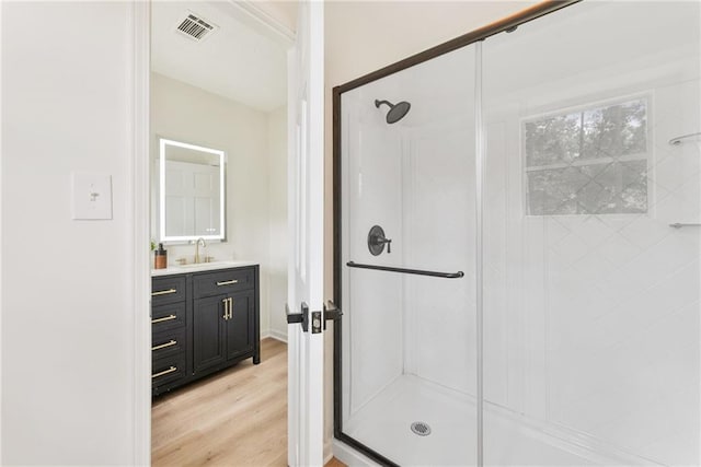 5759 Albans Way, Lithonia, GA 30058 - bathroom featuring a shower stall, vanity, and wood finished floors