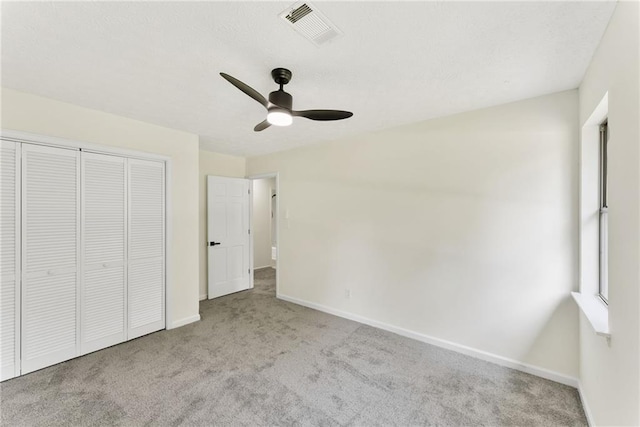 5759 Albans Way, Lithonia, GA 30058 - unfurnished bedroom with carpet, baseboards, a closet, and a ceiling fan