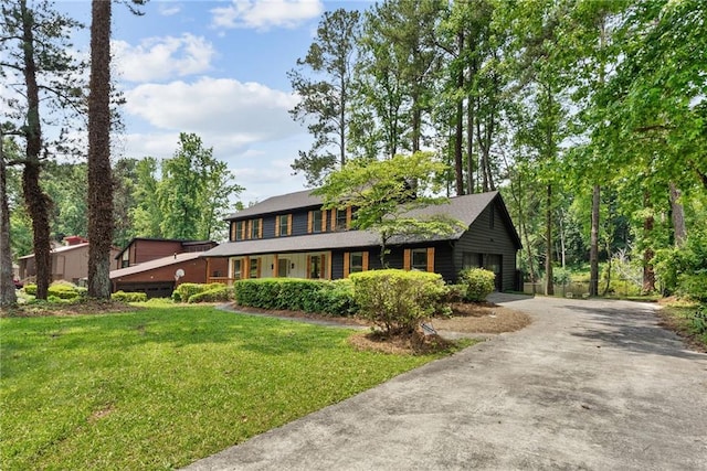 5759 Albans Way, Lithonia, GA 30058 - view of front facade with a front yard, a garage, driveway, and a porch