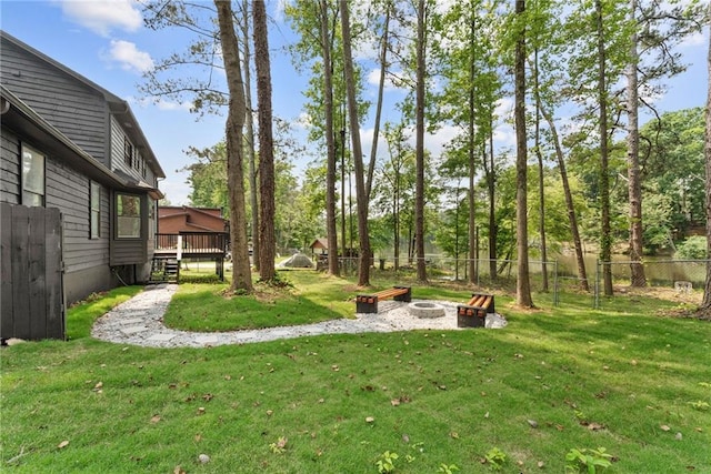 5759 Albans Way, Lithonia, GA 30058 - view of yard featuring an outdoor fire pit and a deck