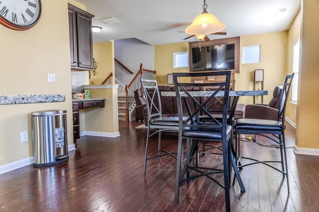 dining room with dark hardwood / wood-style floors