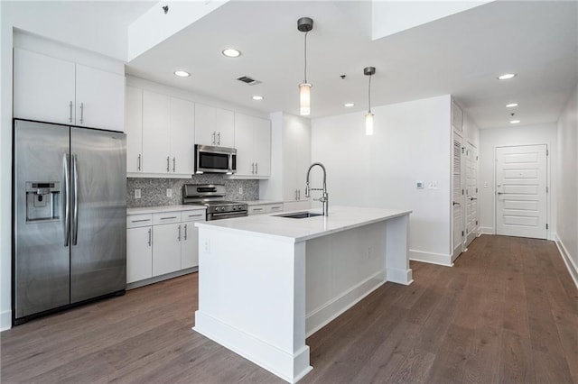 kitchen featuring white cabinets, a sink, and appliances with stainless steel finishes
