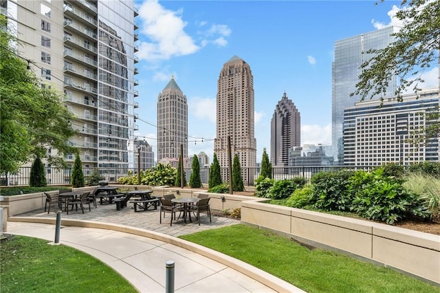 surrounding community featuring fence and a view of city