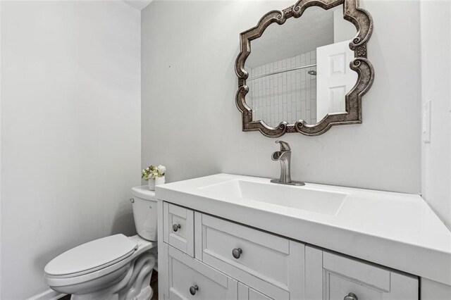 bathroom featuring vanity and toilet