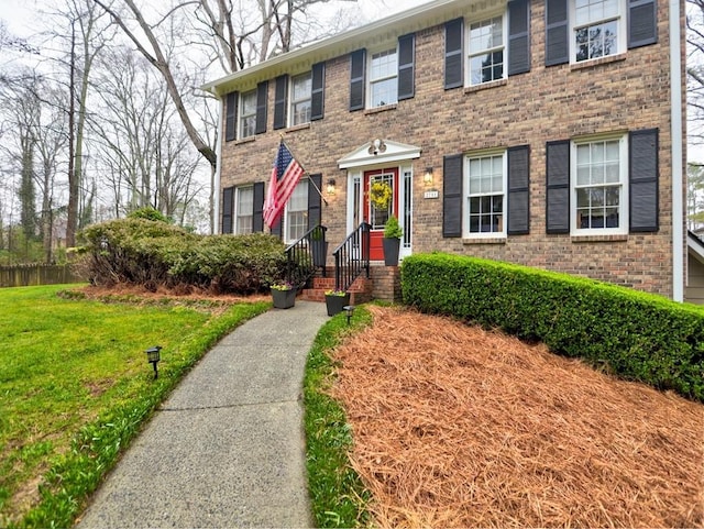 colonial home with a front yard