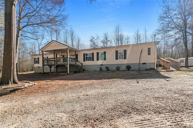 manufactured / mobile home with a wooden deck