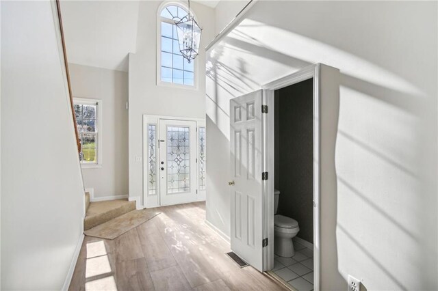 entrance foyer featuring a chandelier and light hardwood / wood-style floors