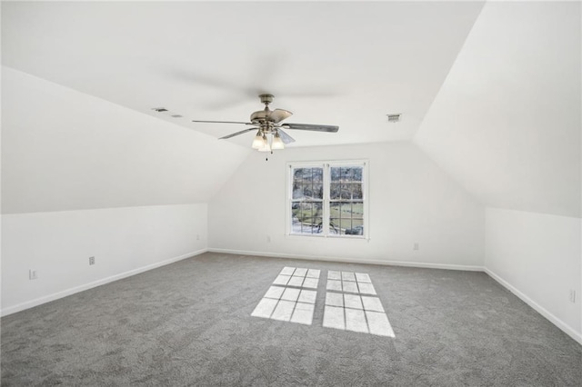 bonus room with vaulted ceiling, ceiling fan, carpet, and visible vents