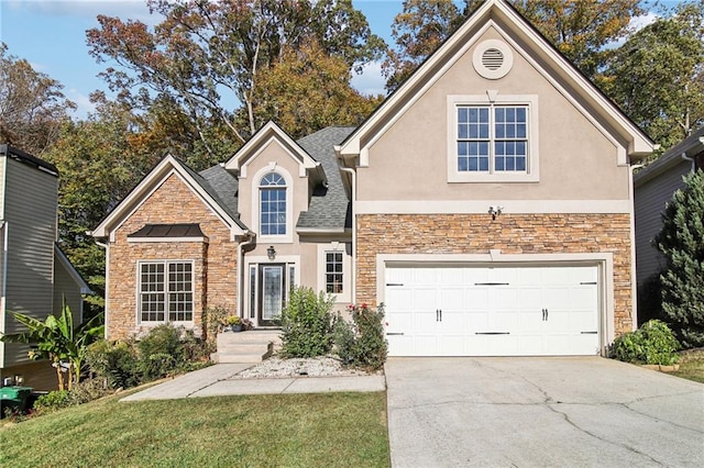 traditional-style house with stone siding, driveway, and stucco siding