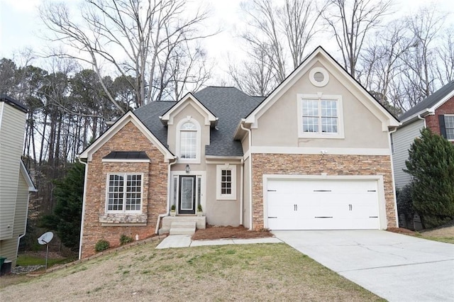 traditional home featuring stone siding, concrete driveway, and stucco siding