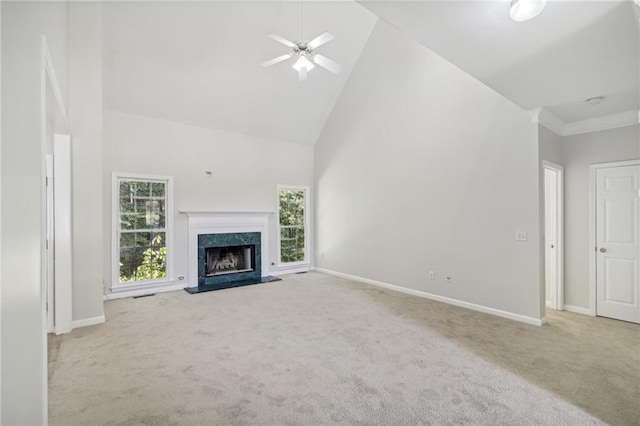 unfurnished living room with carpet floors, high vaulted ceiling, and baseboards