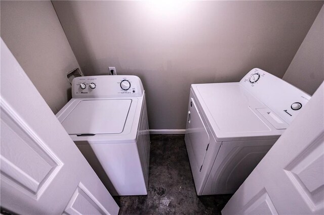 laundry room featuring washing machine and clothes dryer