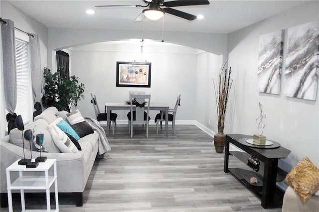 3046 Dobbs Way, East Point, GA 30344 - living room with arched walkways, a ceiling fan, light wood finished floors, recessed lighting, and baseboards