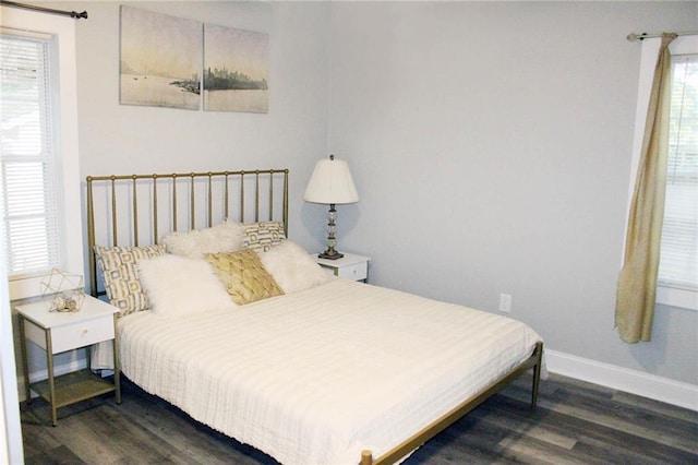3046 Dobbs Way, East Point, GA 30344 - bedroom featuring dark wood-type flooring, multiple windows, and baseboards