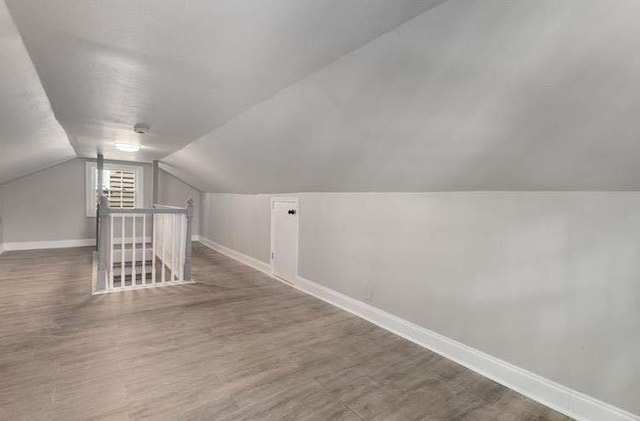 3046 Dobbs Way, East Point, GA 30344 - additional living space featuring lofted ceiling, baseboards, and wood finished floors