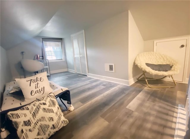 3046 Dobbs Way, East Point, GA 30344 - living area with baseboards, vaulted ceiling, and wood finished floors