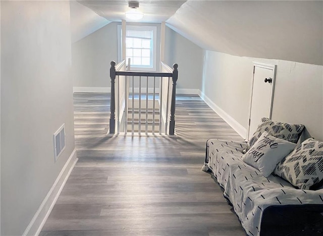 3046 Dobbs Way, East Point, GA 30344 - bonus room with wood finished floors, baseboards, and vaulted ceiling