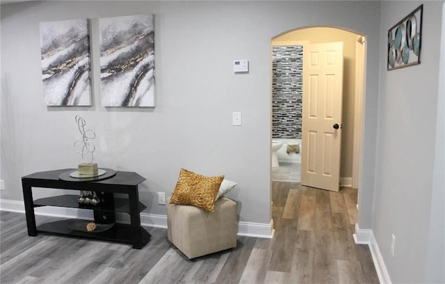 3046 Dobbs Way, East Point, GA 30344 - corridor with arched walkways, wood finished floors, and baseboards