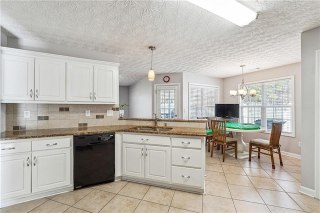 kitchen with pendant lighting, white cabinetry, black dishwasher, tasteful backsplash, and kitchen peninsula